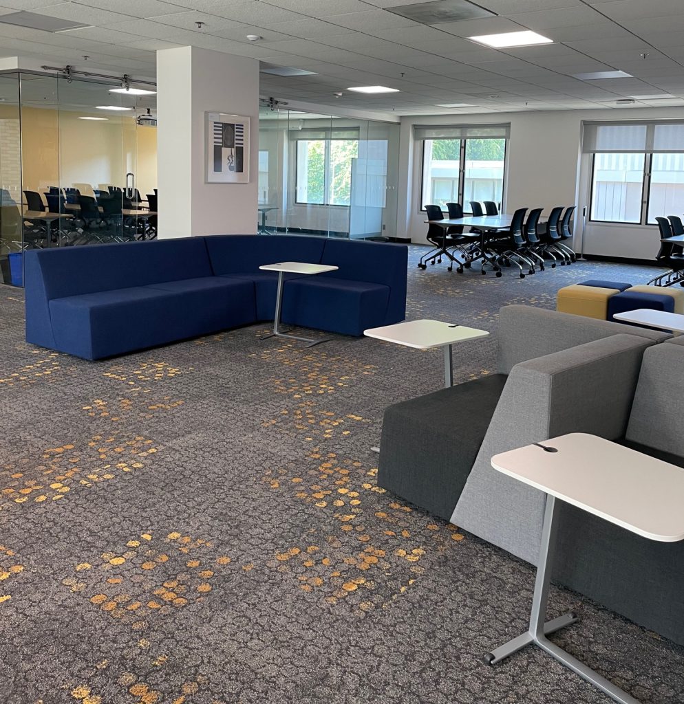 Graduate Collaboration Hub open space with soft couches, chairs, and tables