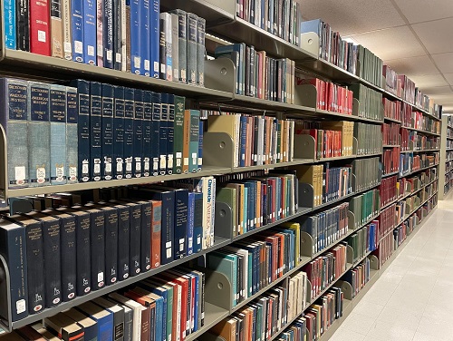 Shelves of books in the Portland State University Library